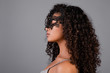 © Anastasia - beautiful black woman wearing elegant masquerade mask isolated over grey