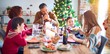 © Krakenimages.com - Beautiful family smiling happy and confident. Eating roasted turkey celebrating christmas at home