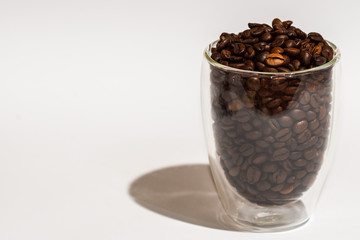 Coffee beans in cup and all around. Background. Texture