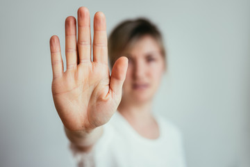 defense or stop gesture: girl hand with stop gesture