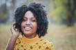 © Igor Butseroga - Young dark-skinned woman dressed in casual clothes