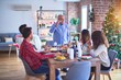 © Krakenimages.com - Beautiful family smiling happy and confident. Man speaking a speech celebrating Christmas at home
