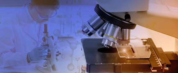 Wall Mural - laboratory concept; close up picture of microscope with blurred background of researcher use microsc