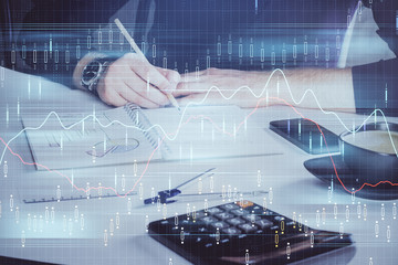 Wall Mural - Double exposure of man doing analysis of stock market with forex graph.