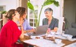 © Krakenimages.com - Meeting of middle age women having lunch and drinking coffee. Mature friends smiling happy using laptop at home on a sunny day