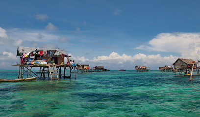 Wall Mural - Malaysia. A Gypsy fishing village on one of the many islets on the East coast of Borneo.