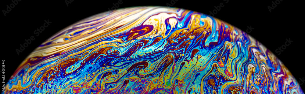 Macro picture of half soap bubble psychedelic color on black background - obrazy, fototapety, plakaty 
