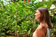 © Krakenimages.com - Young beatiful woman smiling happy and cheerful at butterfly garden on a sunny day of summer