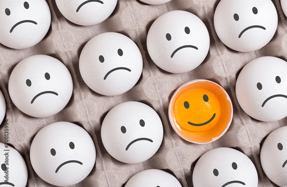 be different concept.smiling face among group of sad faces - obrazy, fototapety, plakaty 