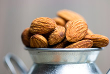 Close Up On Almond Seed On Iron Bucket 