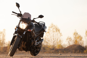 Wall Mural - One black motorcycle in the desert.