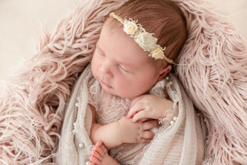 newborn baby sleeping on a little pillow