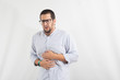 Portrait of man with stomachache. White background portrait.