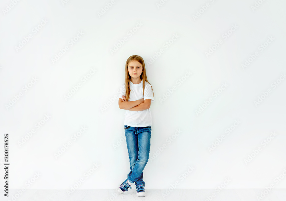 Cute little girl with crossed hands isolated on white - obrazy, fototapety, plakaty 