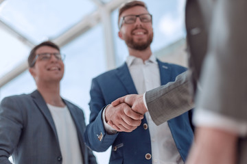 close up. handshake business partners on a blurred background