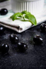 Wall Mural - Black olives on black stone