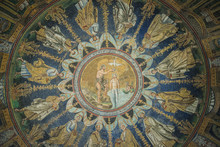 RAVENNA, ITALY - September 11, 2019: Magnificent Mosaic Painting On The Ceiling Of The Baptistery Of Neon, Built In The 5th Century. Showing The Baptism Of Jesus, The Apostles Around. South Europe.