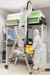 © Pvince73 - Decontamination procedure of a fume cabinet by two operators, environmental laboratory specialized in the analysis of asbestos fibers