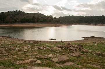 Wall Mural - Dam bed on the Tejo river, in Portugal, without water. It is possible to walk where there should be many cubic meters of water