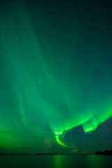 Wall Mural - stars and aurora borealis above lake