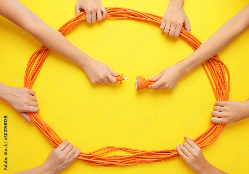 Female hands with drop cord on color background