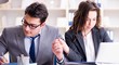 © Elnur - Happy couple working in the same office