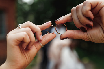 Wedding rings.Wedding rings in hands. The concept of marriage, family relationships, wedding paraphernalia.