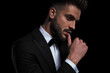 © Viorel Sima - businessman wearing black tuxedo seductively touching lips
