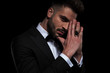 © Viorel Sima - businessman wearing black tuxedo looking at camera with joined hands