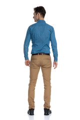 Poster - back view of smart casual man looking to side