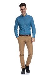 Canvas Print - happy smart casual man wearing blue shirt and walking