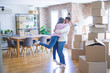 © Krakenimages.com - Young beautiful couple hugging in love celebrating very happy moving to new apartment