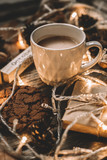Fototapeta Na sufit - Cup of cocoa, garland, cookies, nuts, dried autumn leaves on  wood background. Autumn composition.