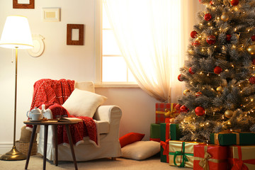 Wall Mural - Stylish room interior with beautiful Christmas tree and gift boxes