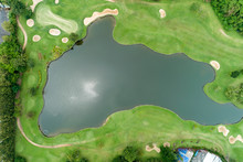 Aerial View Drone Top Down Shot Of Beautiful Green Golf Field High Angle View In Summer Time