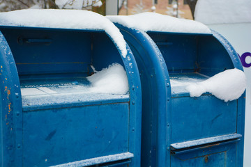 Blue Mailboxes with Snow on Them