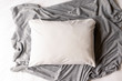 © StaCheck Photography - Plain white pillowcase on a grey and white textile background - cushion mockup - pillow flat lay