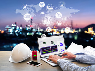 Wall Mural - Engineer Industrial working in office at Oil and gas Industry refinery zone,Industry petrochemical concept image and Icon flow automation and connecting data exchange in manufacturing technology.