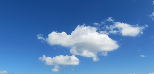 Beautiful fluffy clouds in blue sky, natural background