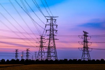 Electricity tower silhouette and sky landscape at dusk