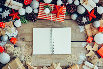 Wall Mural - Christmas background with letter and gift boxes on the wooden ta