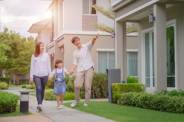 family walking on the model new house looking for living life future, new family meet new house