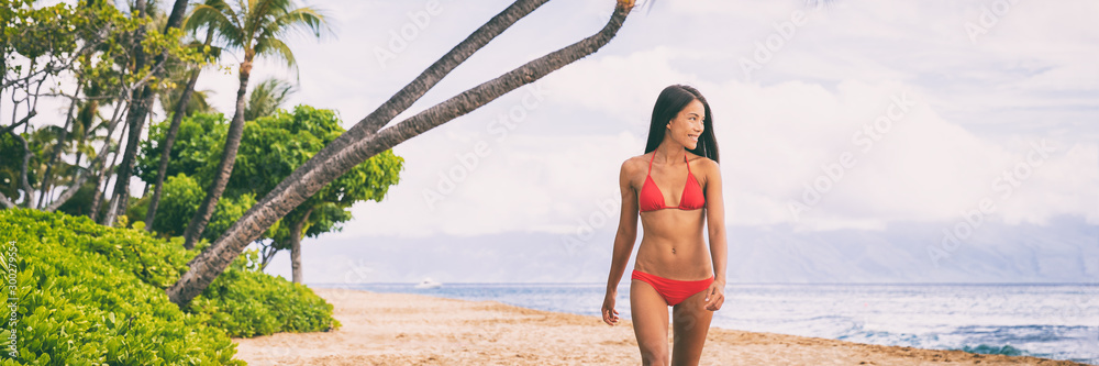 Beach beautiful fit Asian bikini girl walking relaxing on Maui island beach vacation destination ,Hawaii, USA. Panoramic banner young people summer travel lifestyle. Stock-foto | Adobe Stock