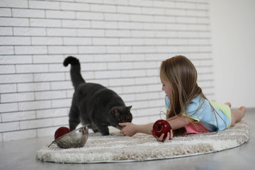 little girl lies on the floor