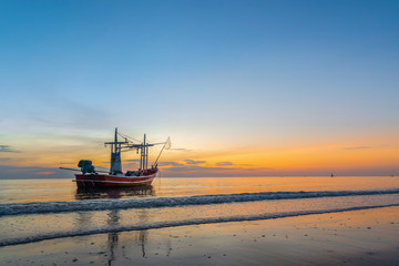 Fishing vessel with sea ocean in sunrise time.