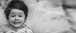 © alexkich - Black and white photo portrait of a young child lying on a pillow