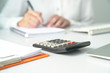 © sinseeho - Office table view with out of focus on Accountant, focus on calculator