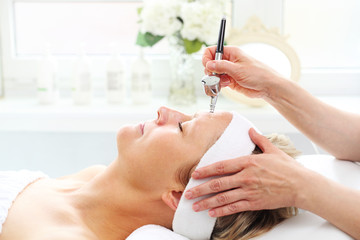 oxygen infusion, oxygen bioinfusion procedure. the beautician performs an oxygen infusion treatment 