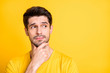 © deagreez - Close-up portrait of his he nice attractive lovely doubtful brown-haired guy thinking touching chin creating new idea isolated over bright vivid shine vibrant yellow color background