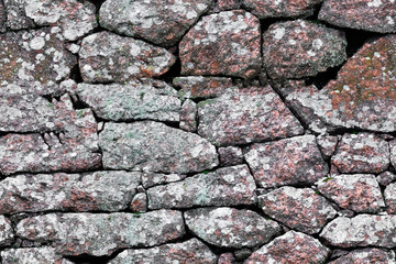 Poster - seamless texture. stone wall made of boulders of granite.